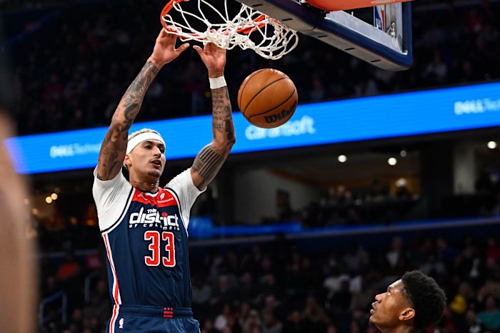 Washington Wizards forward Kyle Kuzma (33) dunks the ball against the Atlanta Hawks during the second half at Capital One Arena.